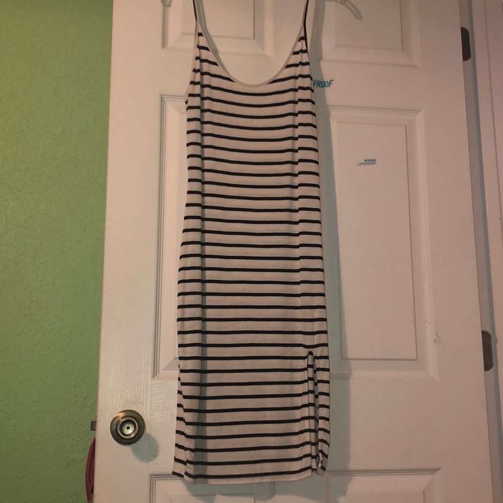 black & white striped dress with slit on left leg